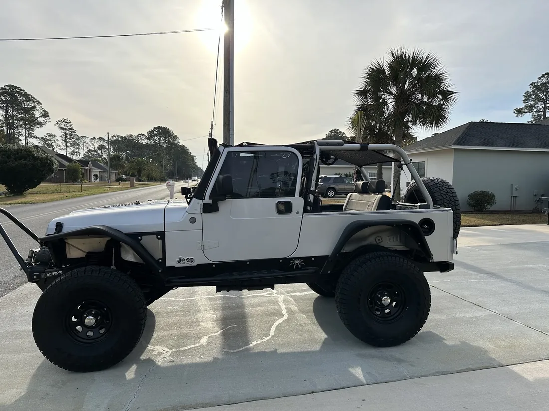 Wrangler on a lift, doors off at Myhree Motors