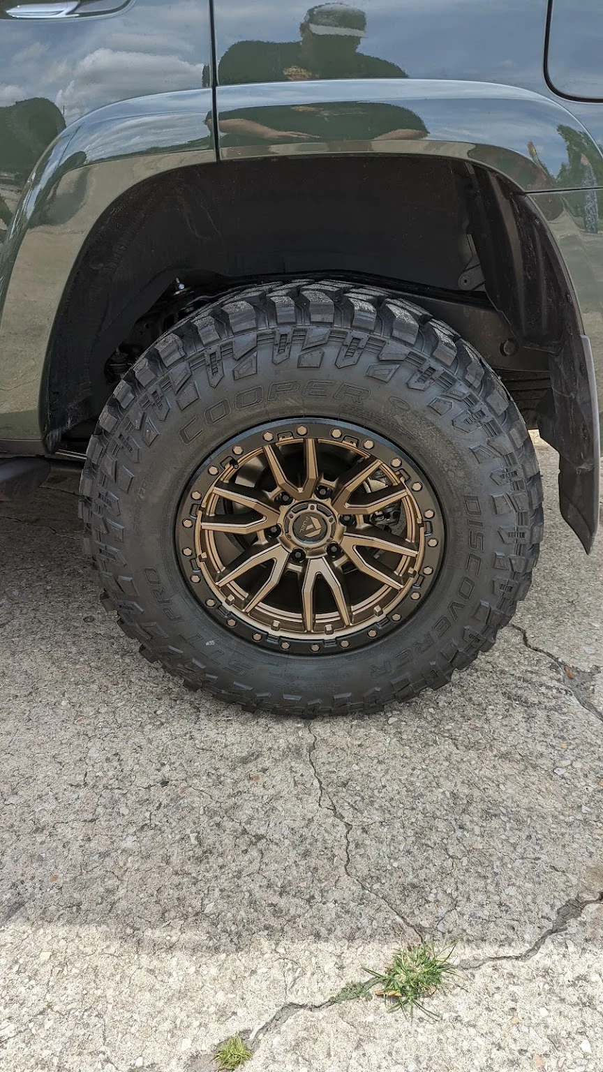 Bronze wheel on a mud tire at Myhree Motors